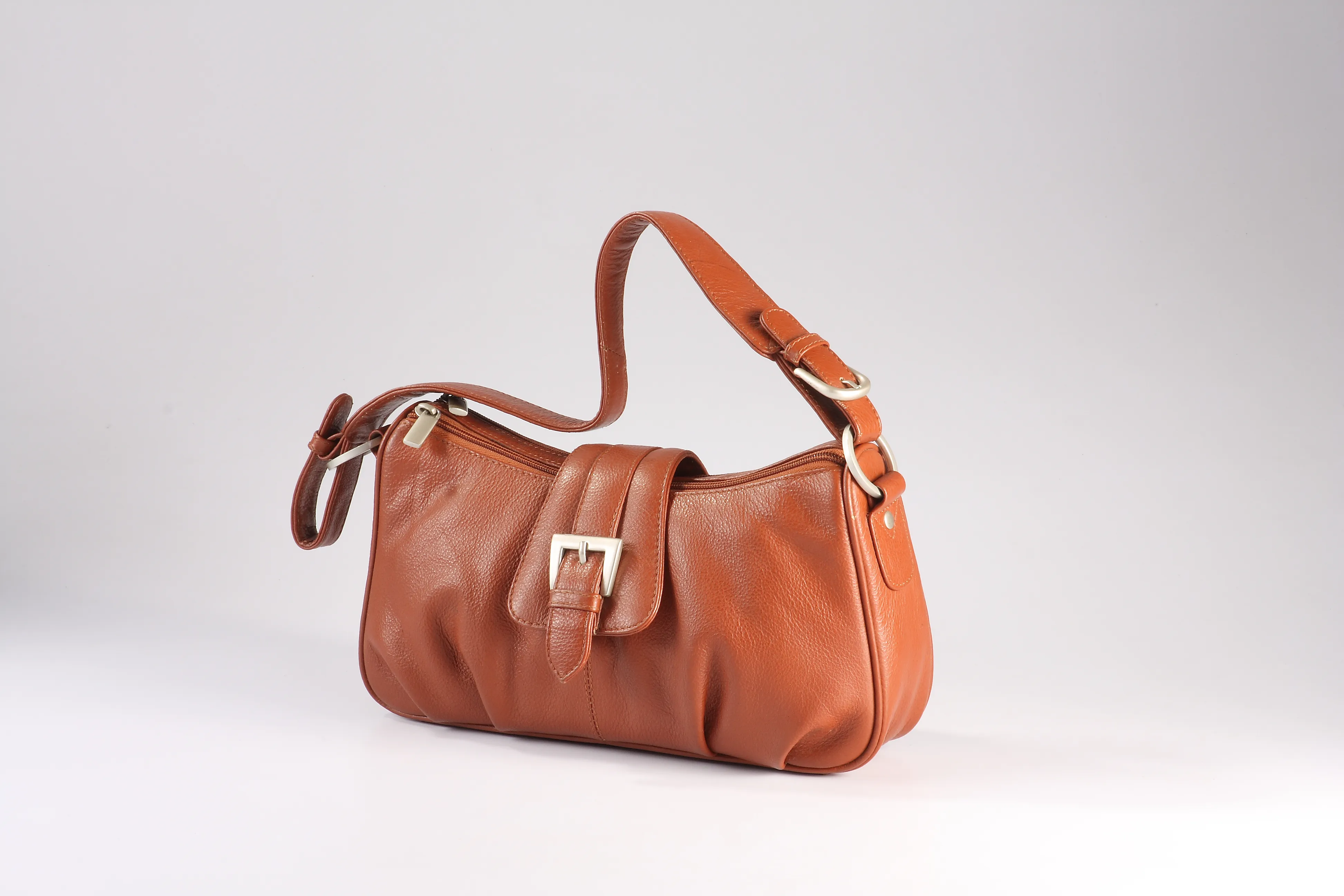 Tan NDM leather handbag with handle buckles has 2 top zip compartments, 1 inside zip pocket, mobile pocket, 3 card slots, and 1 back zip pocket.