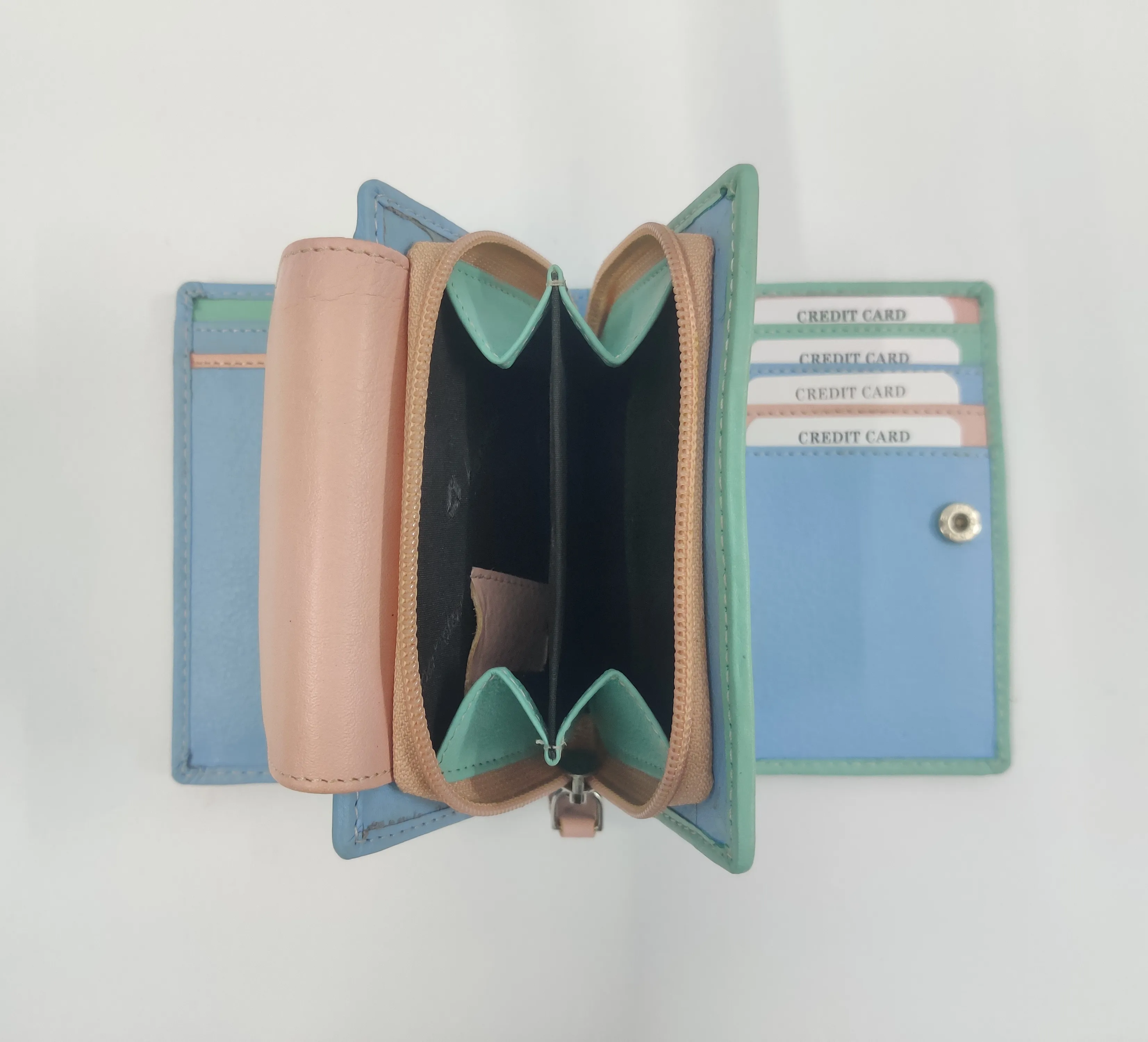 Multi-coloured genuine leather purse with white thread detailing, multiple compartments, and a secure button and zipper closure.