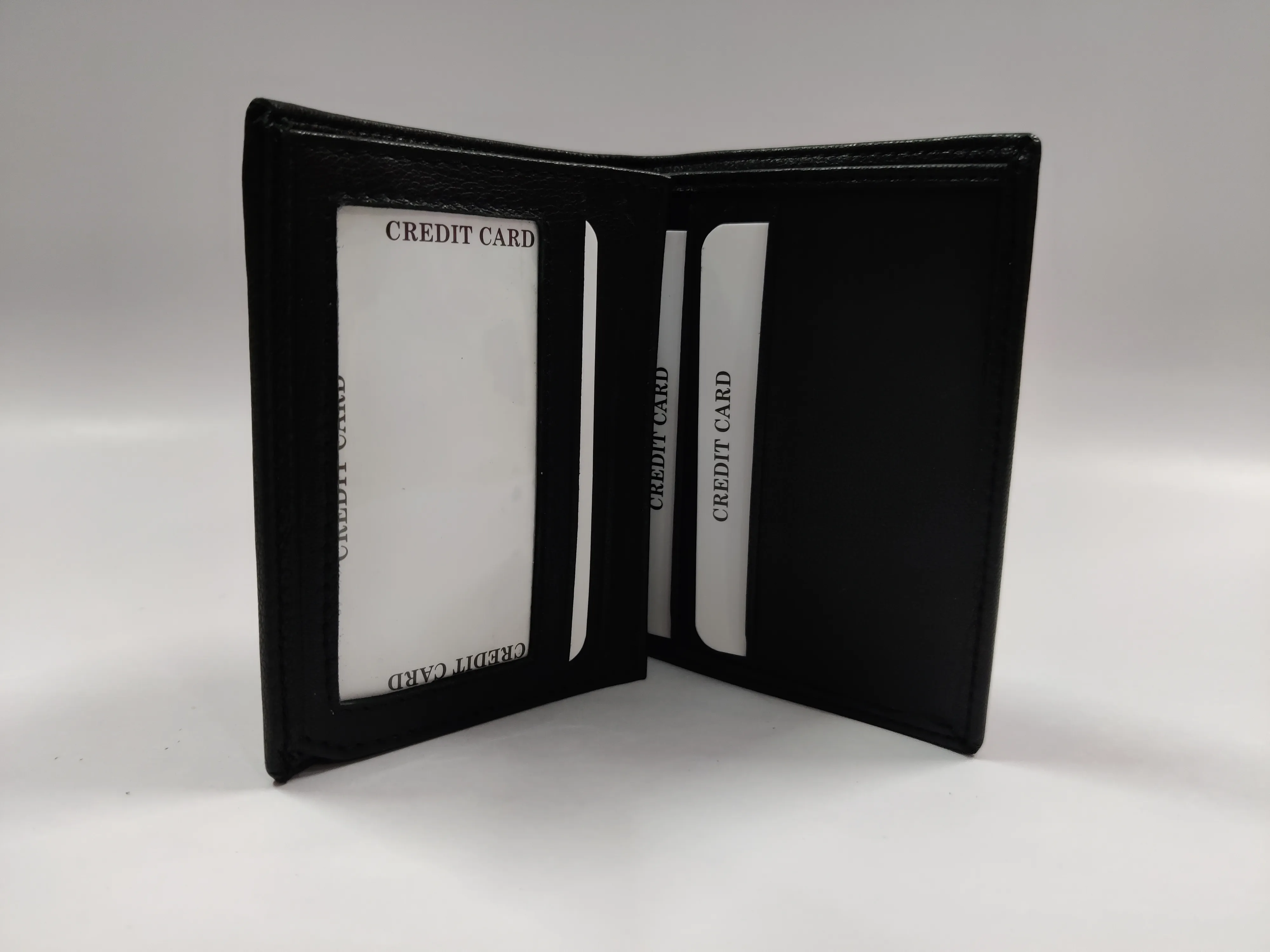 Black goat Nappa leather ladies' bi-fold note purse with multiple credit card slots, ID windows, currency compartments, and a back zip pocket.