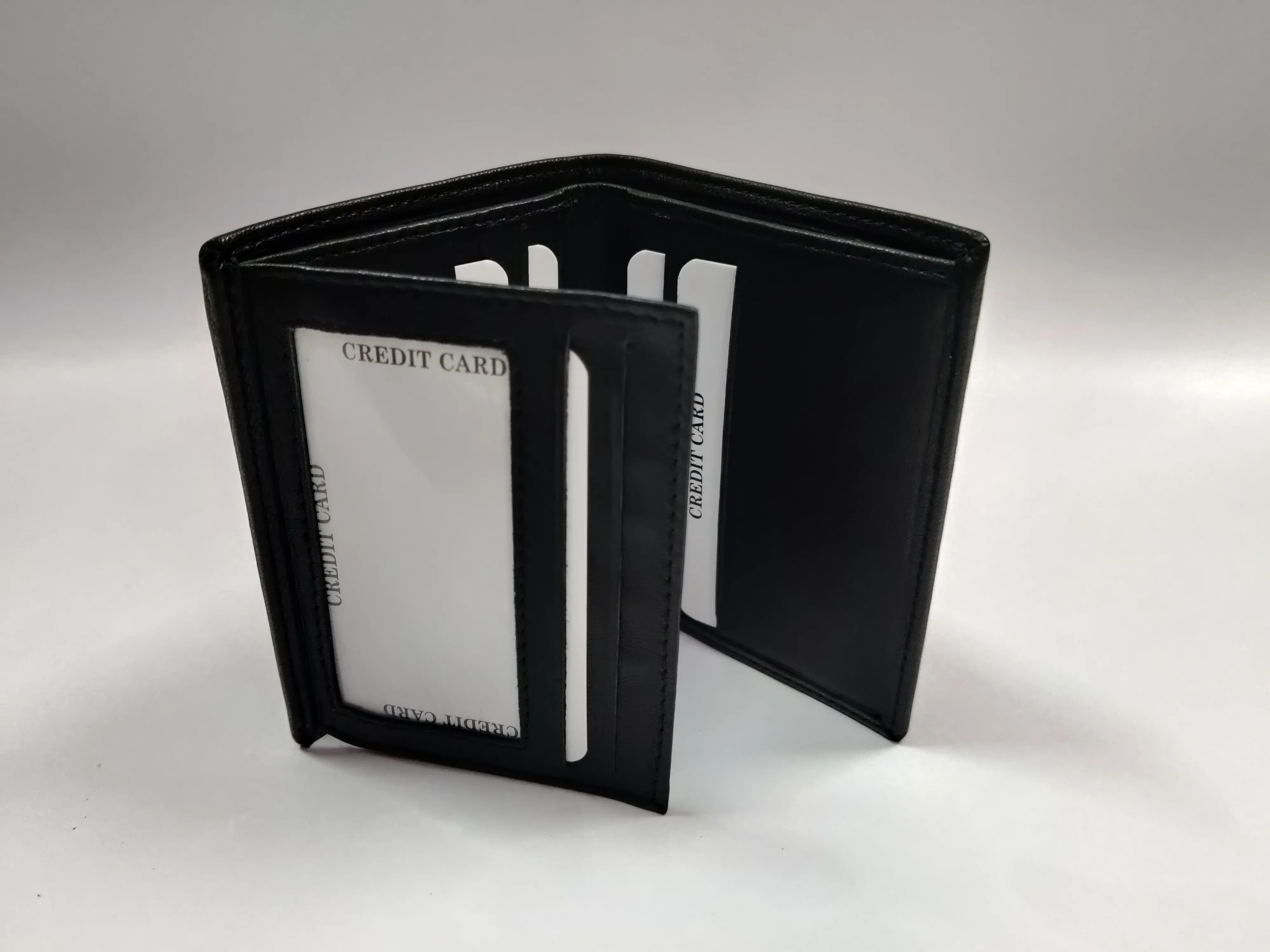 Black goat Nappa leather ladies' bi-fold note purse with multiple credit card slots, ID windows, currency compartments, and a back zip pocket.