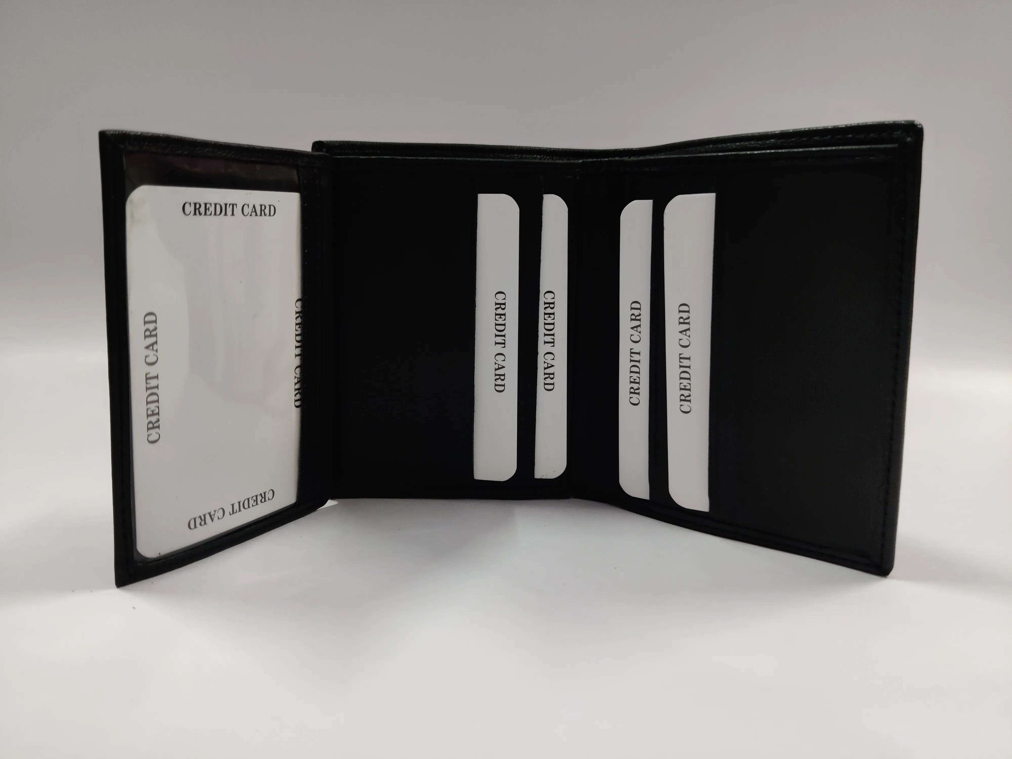 Black goat Nappa leather ladies' bi-fold note purse with multiple credit card slots, ID windows, currency compartments, and a back zip pocket.