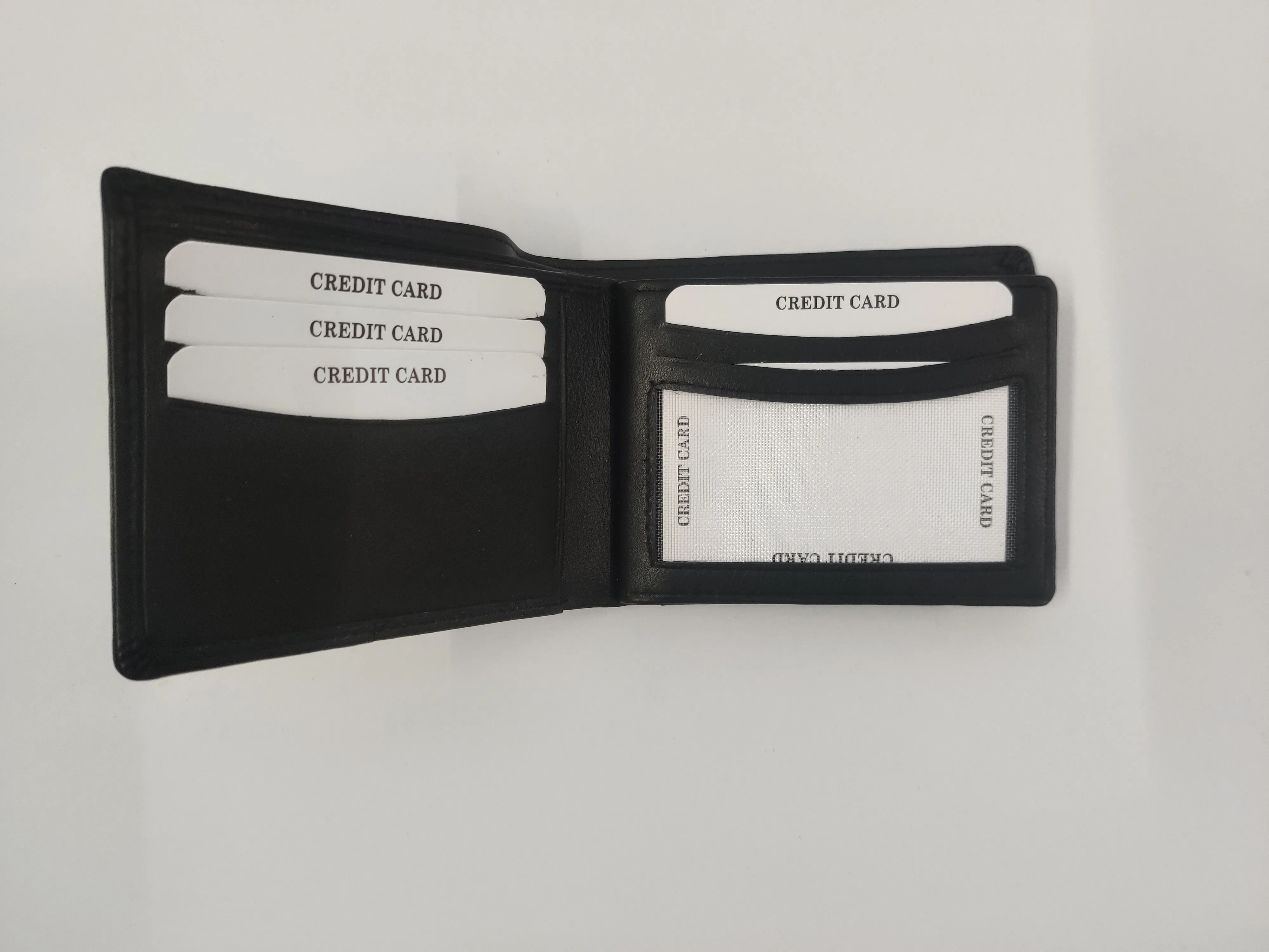 Genuine black leather bifold wallet with crescent card slots, RFID protection, dual ID windows, zippered compartment, and coin pocket.