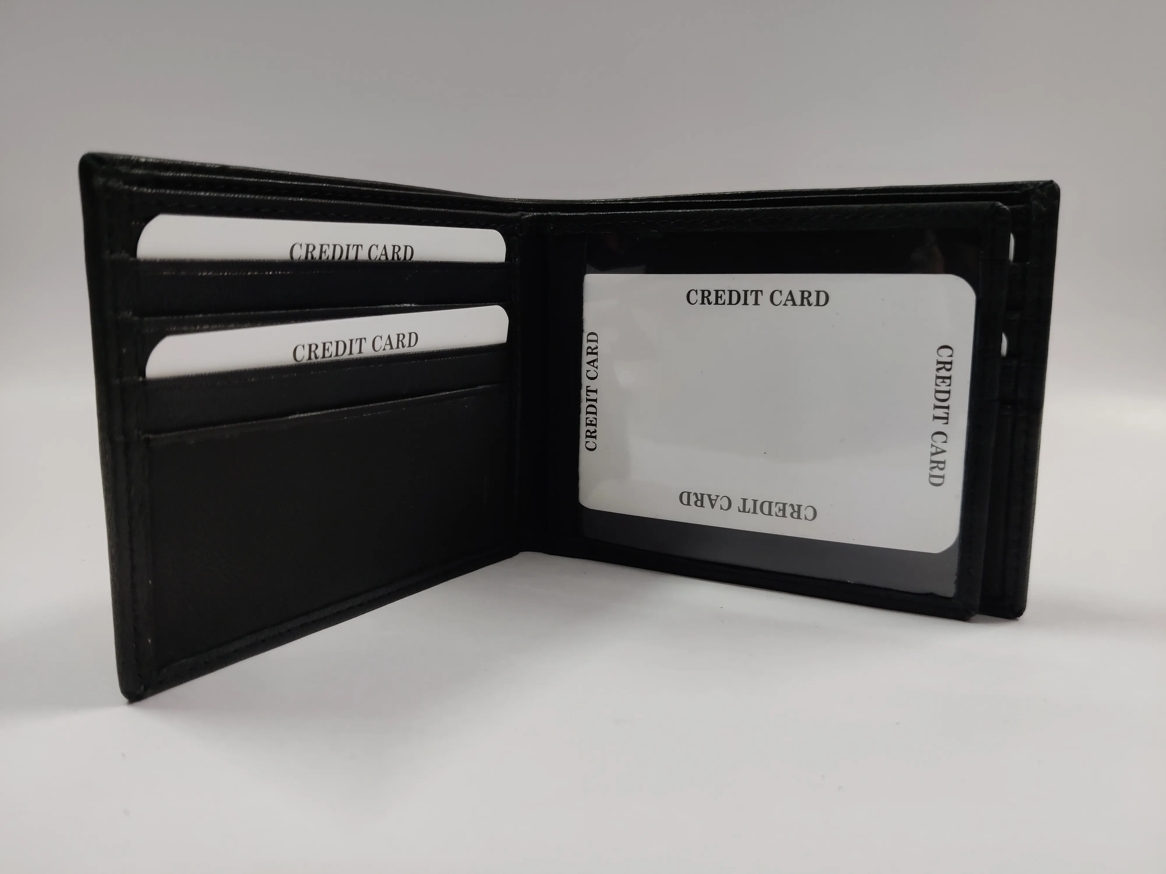 Genuine black goat Nappa leather bifold wallet with horizontal flap, 12 credit card slots, ID window, zippered note compartment, and multiple compartments.