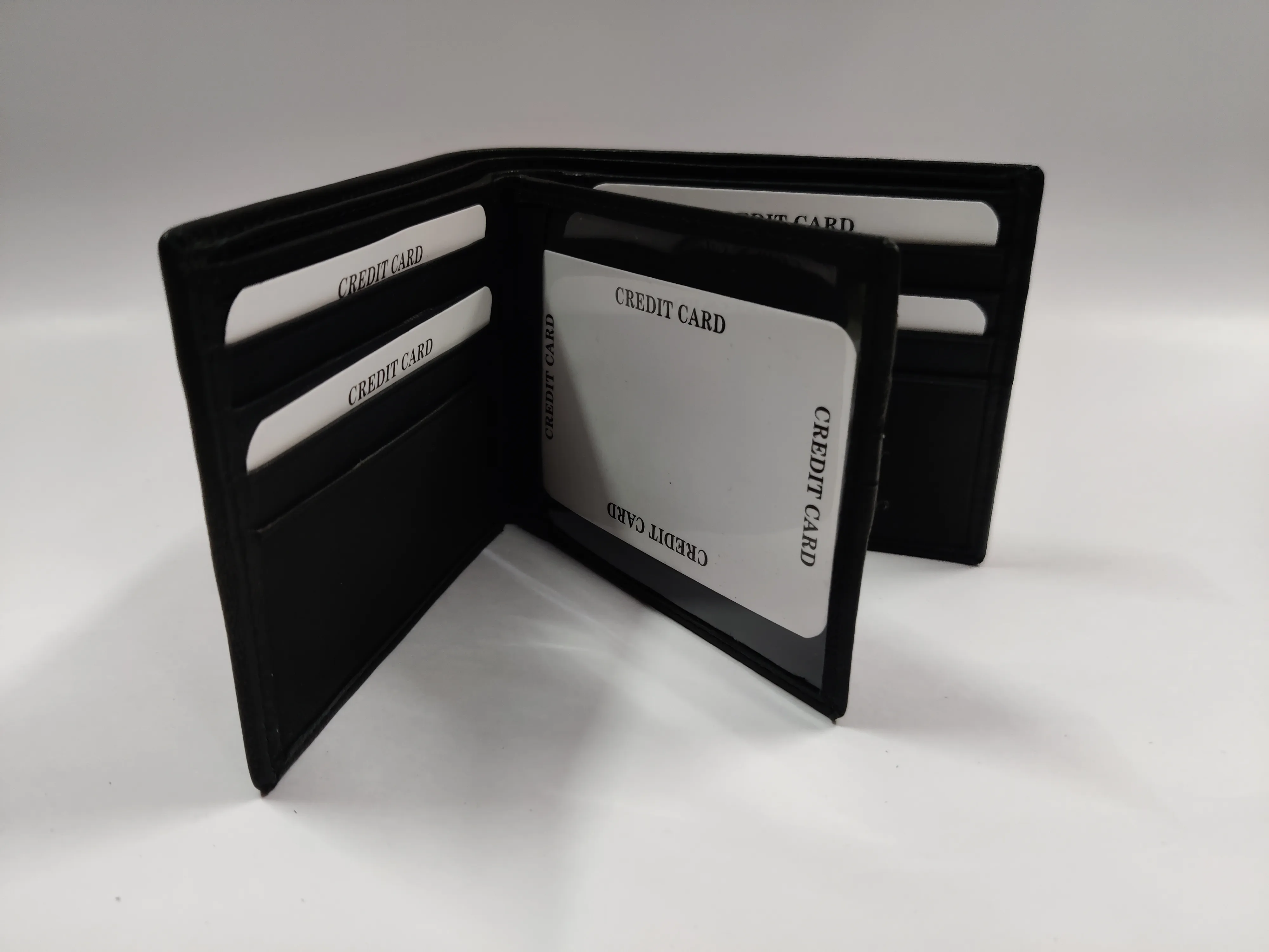 Genuine black goat Nappa leather bifold wallet with horizontal flap, 12 credit card slots, ID window, zippered note compartment, and multiple compartments.