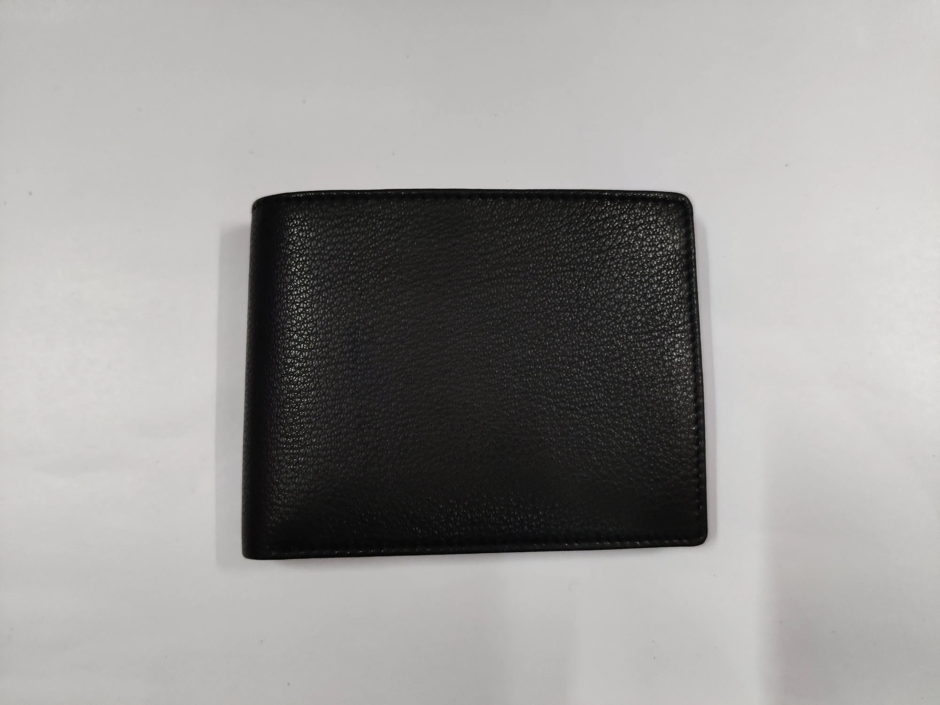 Genuine black goat Nappa leather bifold wallet with horizontal flap, 9 credit card slots, ID window, secret compartments, and dual currency storage.